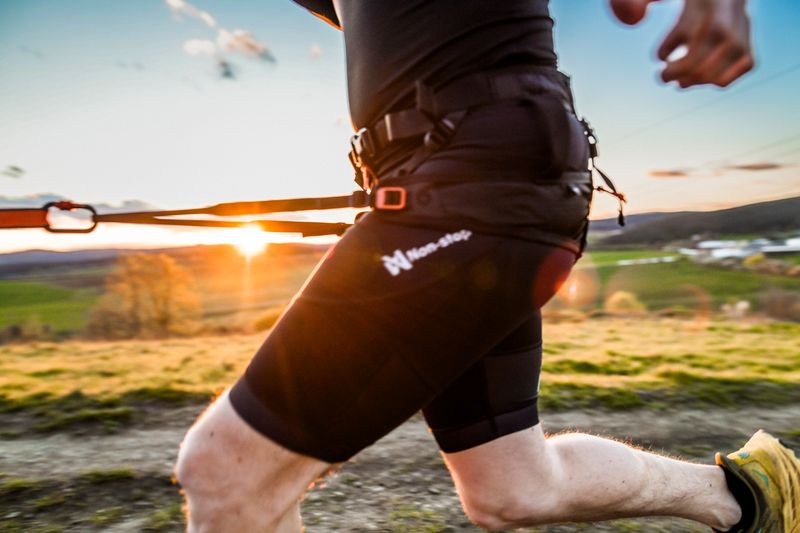 Hands-free canicross belt worn while running with a dog